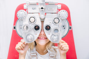 concept vision testing. child girl with eyeglasses