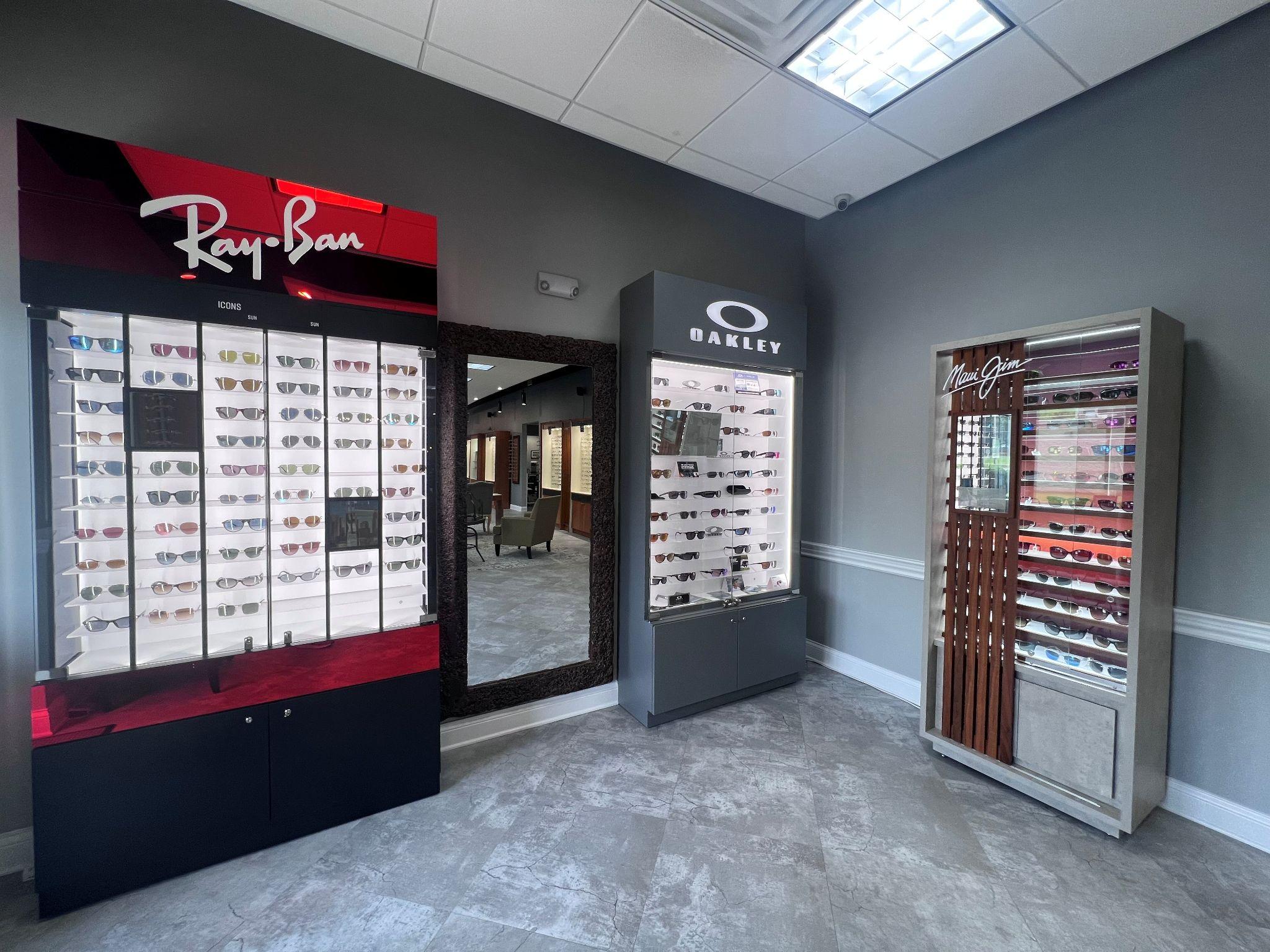 A wall of various sunglass frames in an optometrists clinic in Knoxville