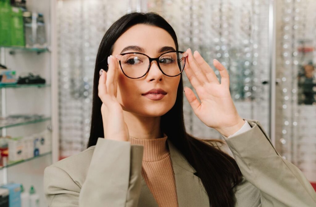 a woman wearing trendy glasses in an optical clinic.